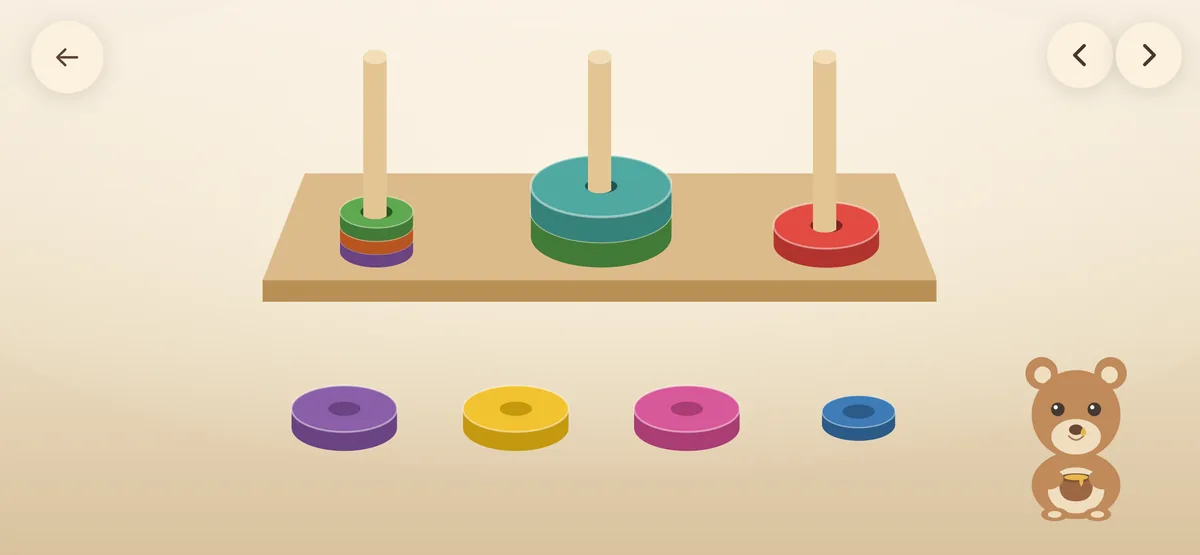 Three pegs with rings of different sizes and four loose rings below