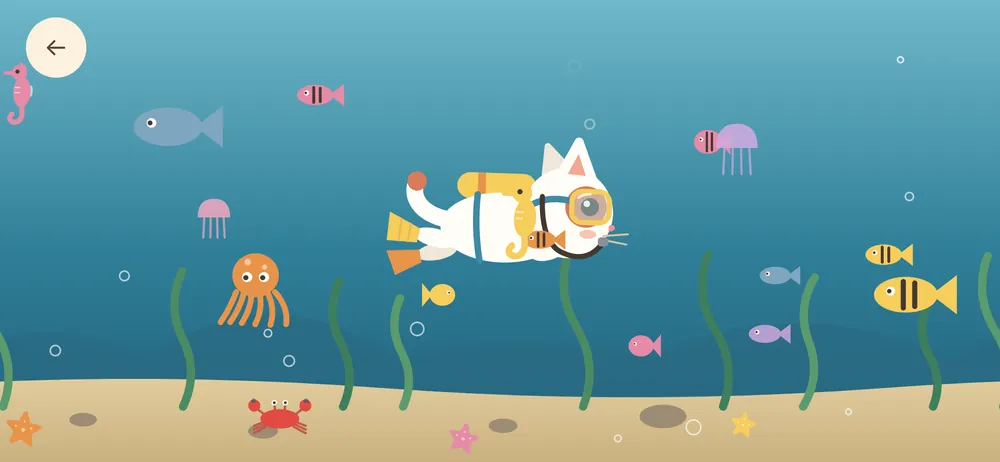 Kiko in a diving mask swimming past fish and jellyfish